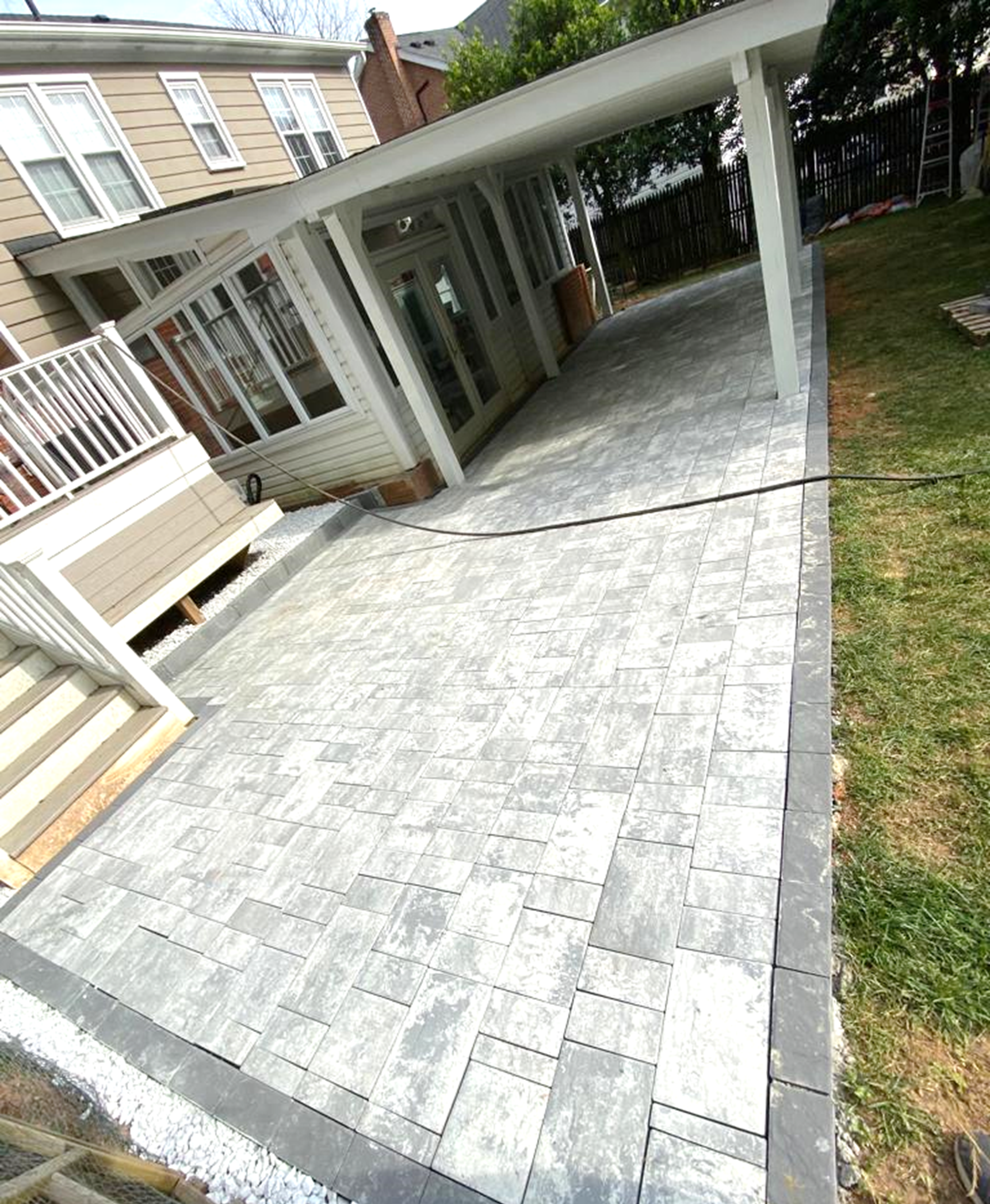 A picture containing outdoor, building, stone, deck

Description automatically generated